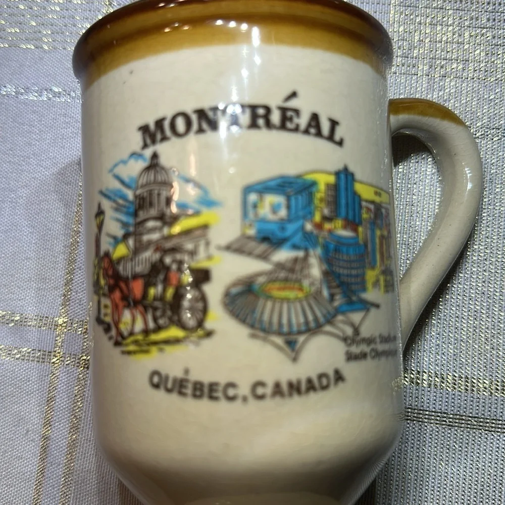 Vintage ceramic souvenir coffee mug with illustration of Montreal Quebec OS